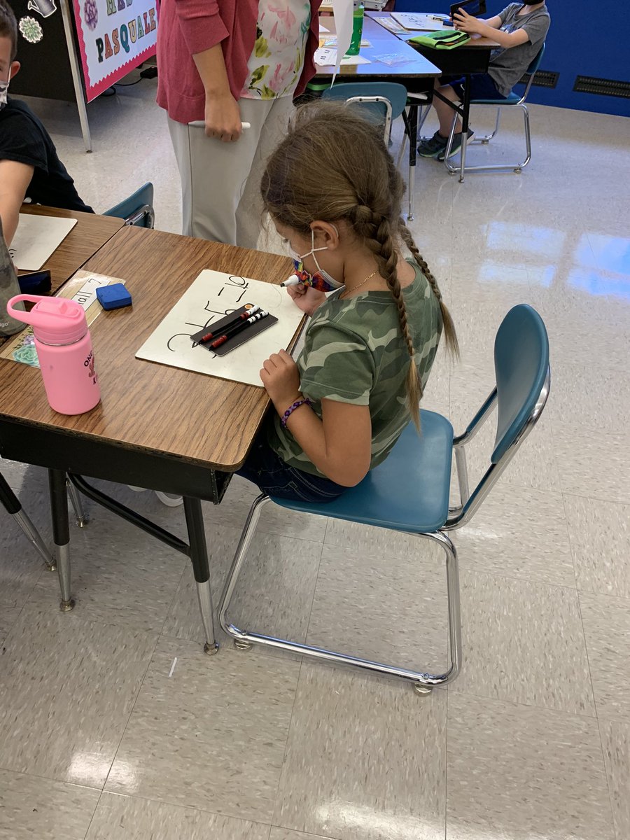 hes_smcps's tweet image. HES Herons in Mrs.  Pasquale’s 1st grade classroom showing their work during math time.