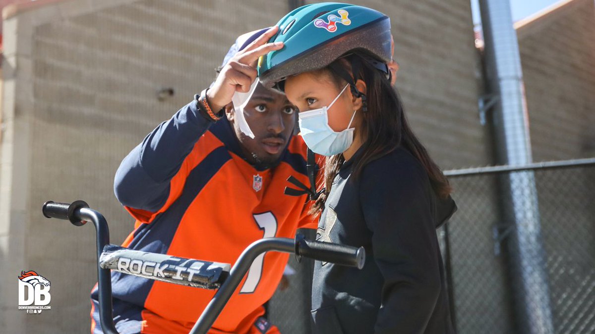Broncos's tweet photo. A few weeks ago, our football staff — led by GM George Paton &amp; Coach Fangio — put together bikes for under-resourced elementary kids in honor of Greg Knapp.

Today, those kids received their bikes from Broncos players, @BroncosCheer &amp; @5280Miles. 🧡

📸's: https://t.co/tPT2rsZ9q5 https://t.co/g0MN0Z28M6