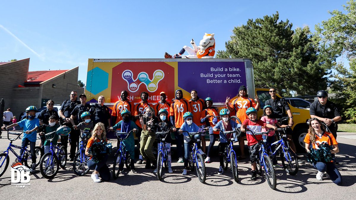 Broncos's tweet photo. A few weeks ago, our football staff — led by GM George Paton &amp; Coach Fangio — put together bikes for under-resourced elementary kids in honor of Greg Knapp.

Today, those kids received their bikes from Broncos players, @BroncosCheer &amp; @5280Miles. 🧡

📸's: https://t.co/tPT2rsZ9q5 https://t.co/g0MN0Z28M6