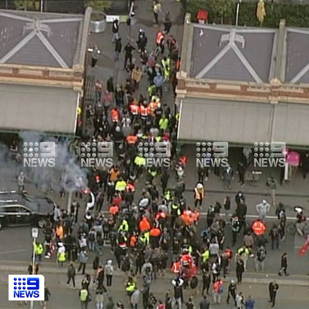 9NewsMelb's tweet photo. DEVELOPING: Protesters have ignited flares at Queen Victoria Market, as angry crowds continue to make their way through Melbourne's CBD.

READ MORE: https://t.co/5mAzIrcCbi

#9News https://t.co/RaXMdiWRat