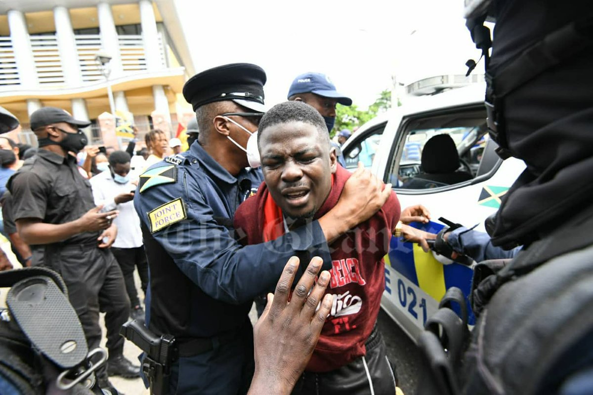 JamaicaGleaner's tweet photo. HAPPENING NOW: Police make several arrests during an anti-vax protest in downtown Kingston. The protest is organised by the Joseph Patterson-led United Independent Congress - Rudolph Brown photos https://t.co/2zphtxMsmb