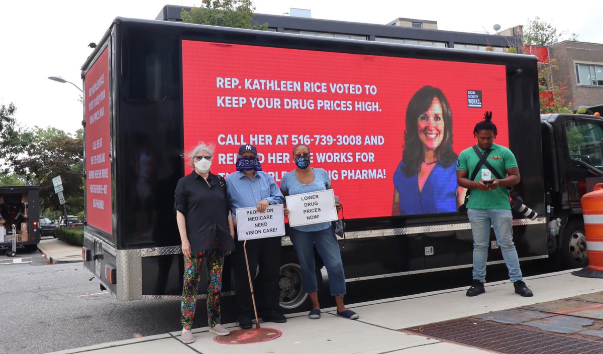Image of activists with our billboard truck, outside Rep Kathleen Rice's office