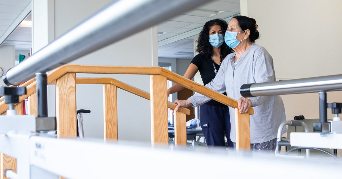 SinaiHealth's tweet photo. Each rehabilitation journey is unique. Sandy, a physiotherapy assistant at Bridgepoint supports Jaqueline through her rehab. At #BridgepointHealth we provide expert care in the hospital and community through partnership, research and education. https://t.co/Jet3s9Zeqw