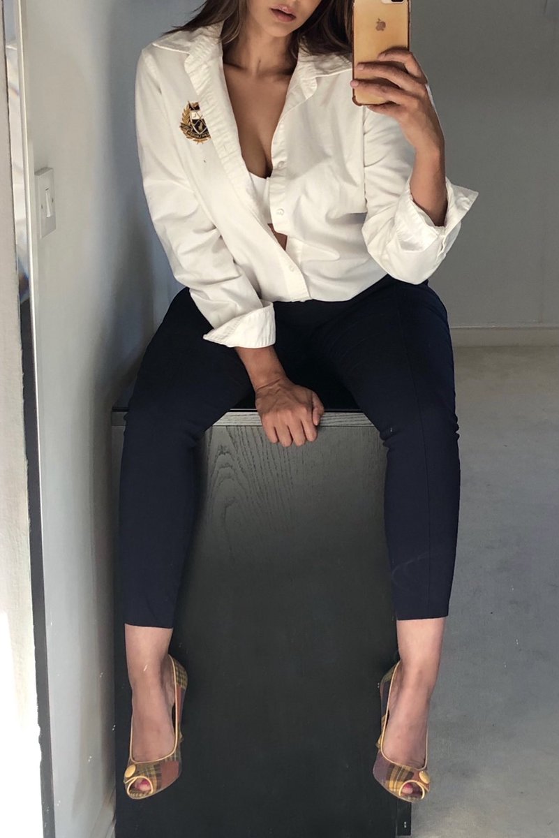 Amber Johal in a black dress