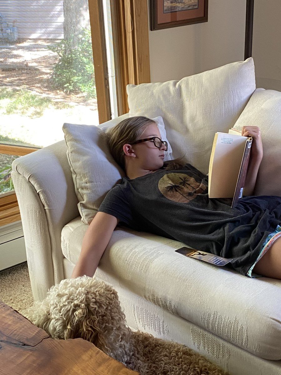 Life is good with a book and a dog. 
Ellie Rosette, a sixth-grader at Mountain Elementary in Los Alamos, got caught reading on a Sunday afternoon. #GetCaughtReading #YearOfLiteracy