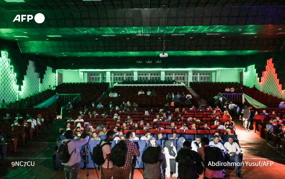 AFP's tweet photo. Built by Chinese engineers as a gift from Mao Zedong in 1967, the National Theatre of Somalia has a history that reflects the tumultuous journey of the Horn of Africa nation. After a painstaking restoration, the theatre's first screening in 30 years was held on Wednesday. https://t.co/BkQfPZayAn