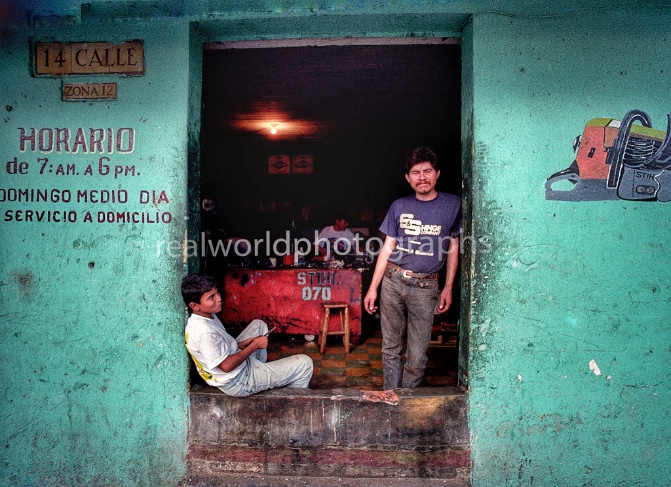 Workers take a break at a small business in Guatemala City, Guatemala, Central America. 1992. Gary Moore photo. Real World Photographs. #guatemala #photography #photojournalism #realworldphotographs #nikon #garymoorephotography #people #cities #places #nineties #sweden #canada #malmo #stock #images  