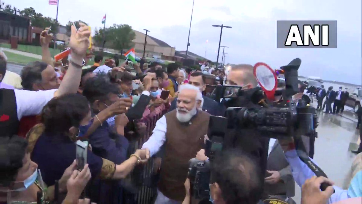 ANI's tweet photo. US: Prime Minister Narendra Modi meets people who were waiting to welcome him at Joint Base Andrews in Washington DC https://t.co/YkAWQSPCI3