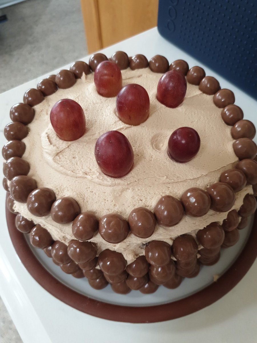 And he thinks he's helping by decorating it with grapes!