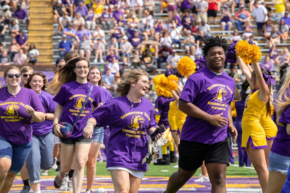 tennesseetech's tweet photo. Running of the Freshmen #TNTech25 bringing all the energy to Tucker Stadium and leading the Golden Eagles on to the field today! #WingsUp https://t.co/6V0Q6moVhX