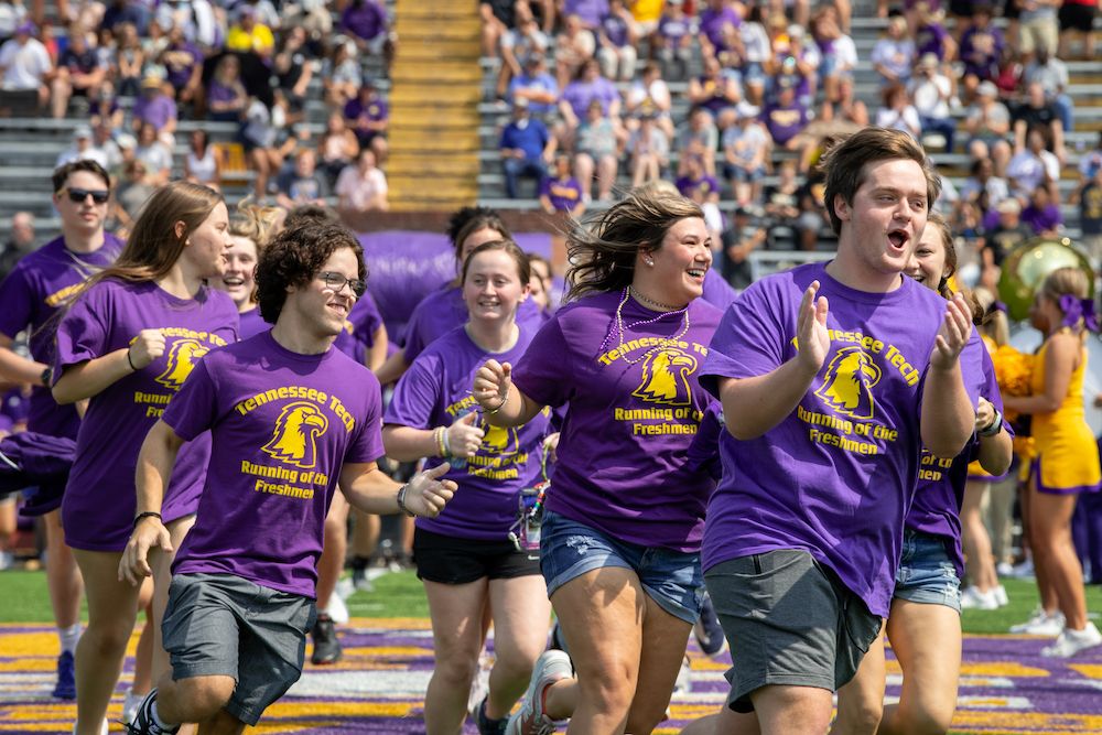 tennesseetech's tweet photo. Running of the Freshmen #TNTech25 bringing all the energy to Tucker Stadium and leading the Golden Eagles on to the field today! #WingsUp https://t.co/6V0Q6moVhX