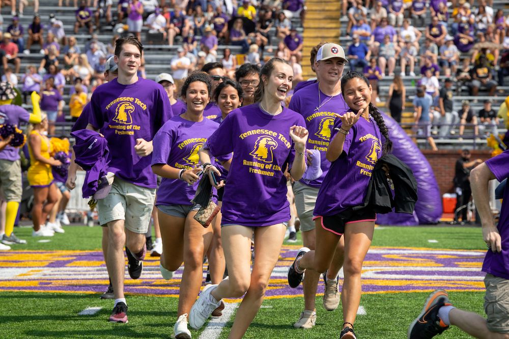 tennesseetech's tweet photo. Running of the Freshmen #TNTech25 bringing all the energy to Tucker Stadium and leading the Golden Eagles on to the field today! #WingsUp https://t.co/6V0Q6moVhX