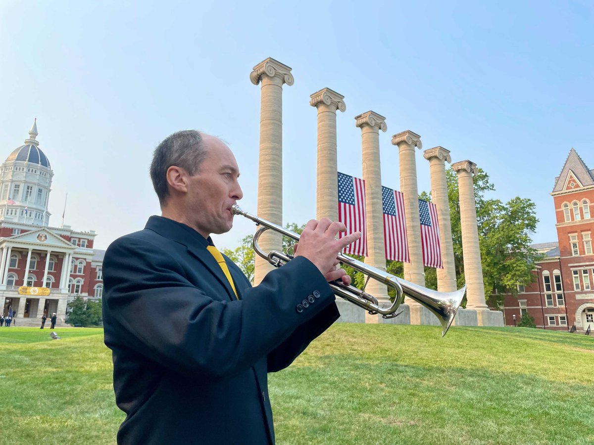 A trumpeter plays in front of Mizzou's six iconic columns on the Francis Quadrangle. 