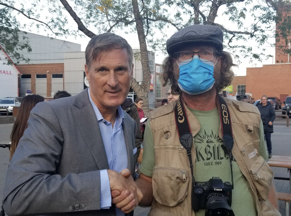 MaximeBernier's tweet image. This is the guy who heckled me at the Edmonton rally this afternoon and who I invited to say a few words to the crowd. 

We’re buddies now! Proof that PPC will unite all Canadians!
#VotePPC