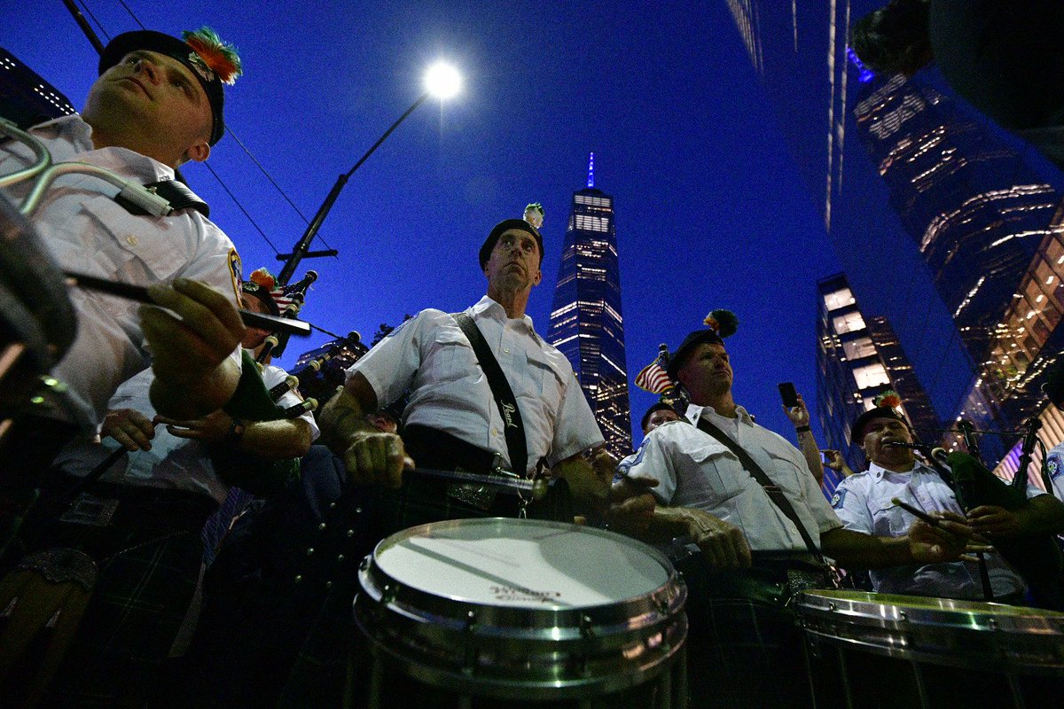 FDNY's tweet image. New Yorkers and visitors to our great city gather as the FDNY Emerald Society Pipes and Drums band honors those who made the Supreme Sacrifice 20 years ago at their annual sunset tribute at FDNY #Engine10 and #Ladder10 #NeverForget