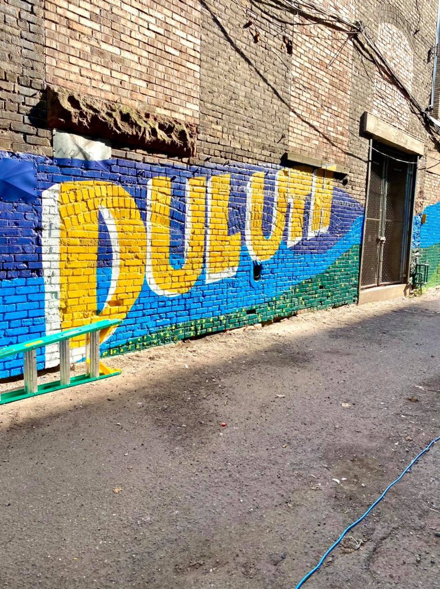 cityofduluth's tweet image. Yesterday volunteers helped local artists complete a project which was a part of the Duluth Street Art Initiative. The project which is located behind the 100 block of West Superior Street. Even LT. Chad Nagorski and Sargent Kelly Greenwalt jumped in to help!