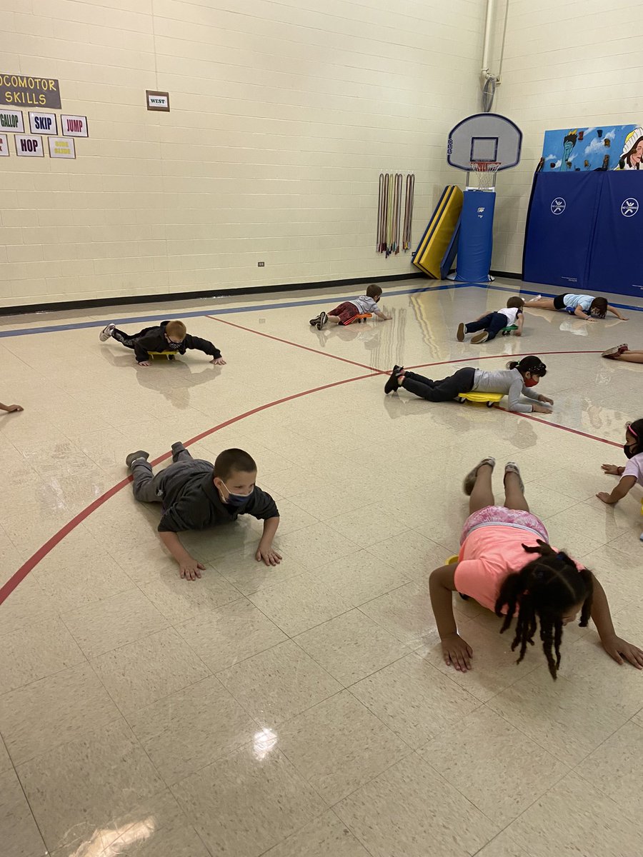 First graders had a blast building their muscular strength on the scooters! Riding on bottoms, knees, and bellies strengthens many different large muscle groups!