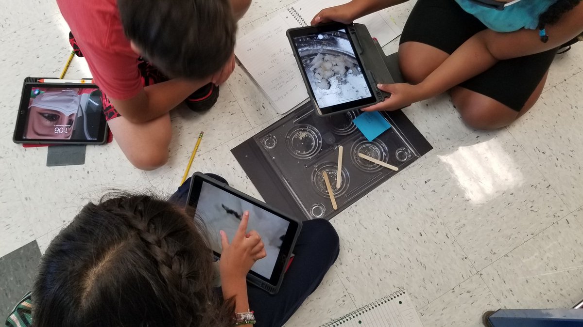 MrsKapotasClass's tweet photo. They're using ipads to zoom in on salt crystals, which were the result of evaporation of a salt water solution!  @SunnyHill220 @CArmendarizMxwl #SeeTheStudent220 #fifthgraderocks https://t.co/9SZLhMcLJq
