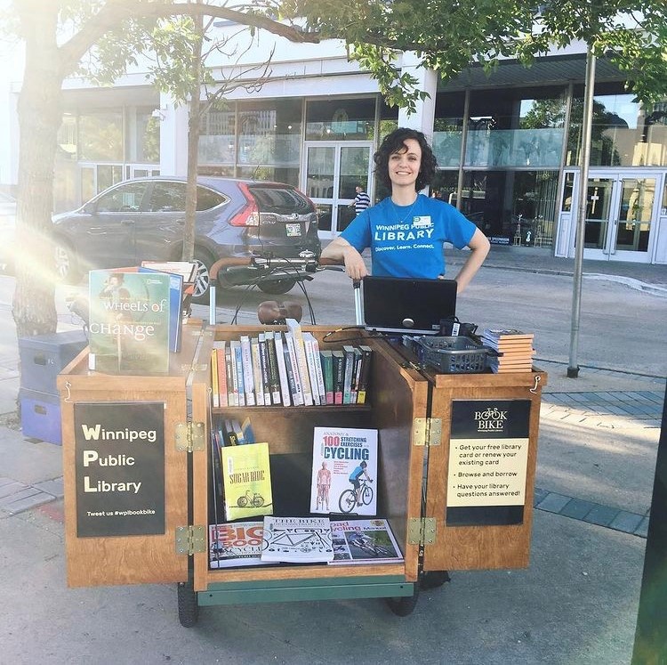 wpglibrary's tweet photo. It's Bike to Work Day! The library is bringing the book bike to the All-Day Pit Stop at the Forks. We will be offering library cards, and have a collection of books on biking to peruse and check-out. Come say "hi" - we'll be there from 11-1.
@BikeweekWPG https://t.co/HvRlEkkxkF