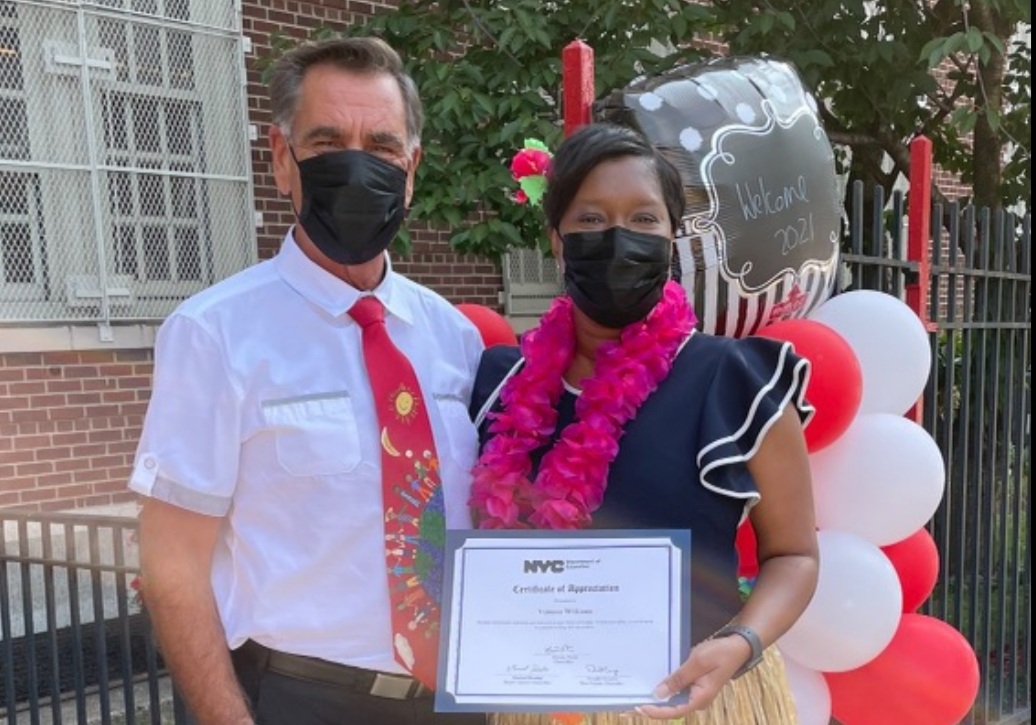 nycdistrict30's tweet photo. Superintendent Dr. Composto presents I.S. 141Q Principal Vanessa Williams with a Certificate of Appreciation from the NYC Schools Chancellor Meisha Porter. Ms. Williams &amp; the rest of the staff welcomed the children back with a Luau Homecoming Theme! #backtoschoolnyc @NYCSchools https://t.co/1UOeu9Ceu7