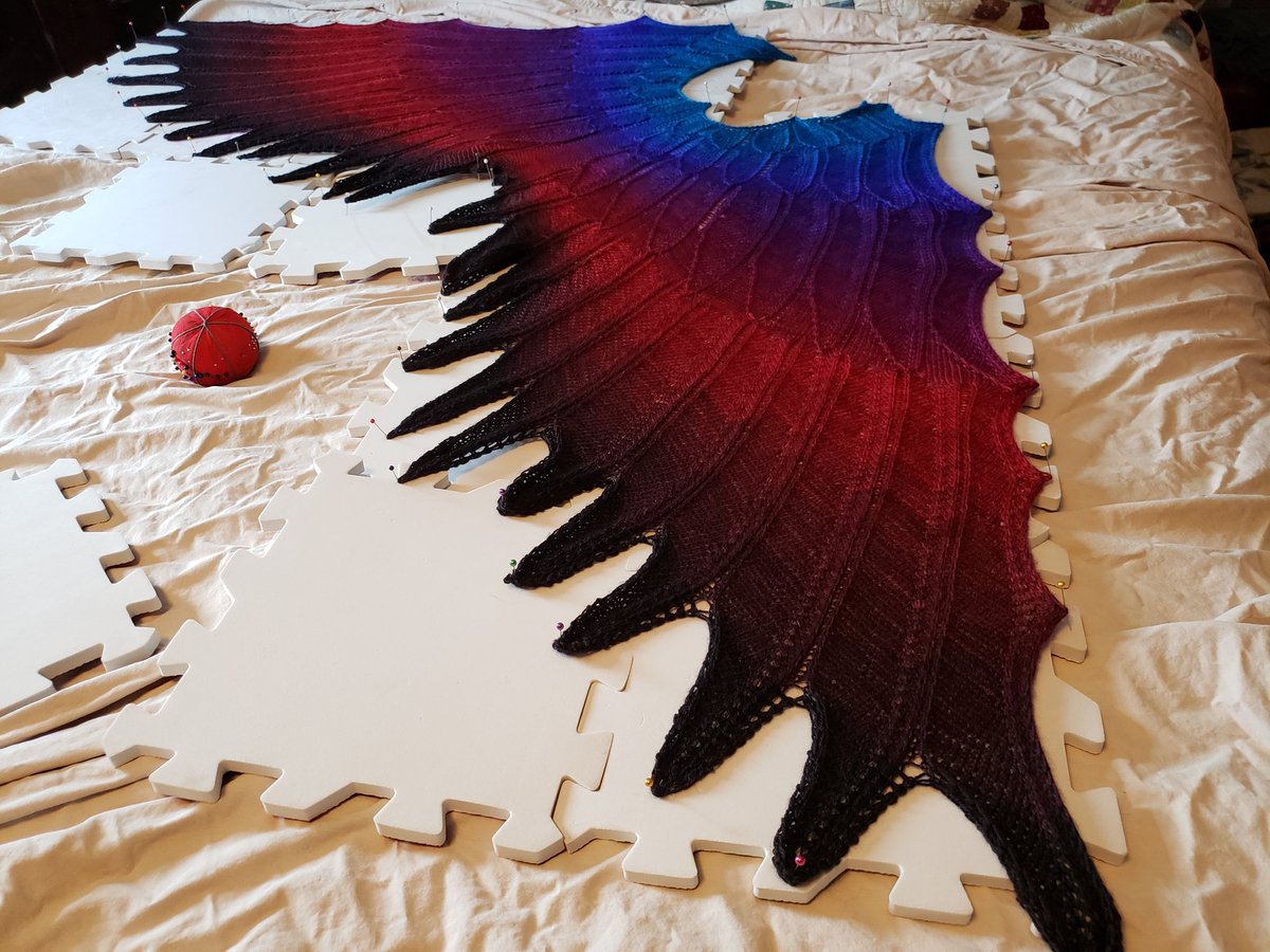 thegeorg's tweet photo. Queen sized bed for reference. Fiber Optic gradients, cerulean-violet crimson, and red to onyx. Medium sized Wingspan. I love it. #MyExcitingLife #SelfishKnitting https://t.co/XEsCwb3XqF