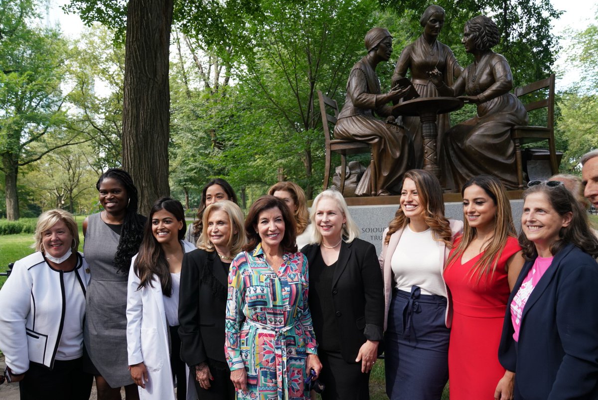 Sen. Kirsten Gillibrand, Gov. Kathy Hochul, and Rep. Carolyn Maloney stand with advocates.