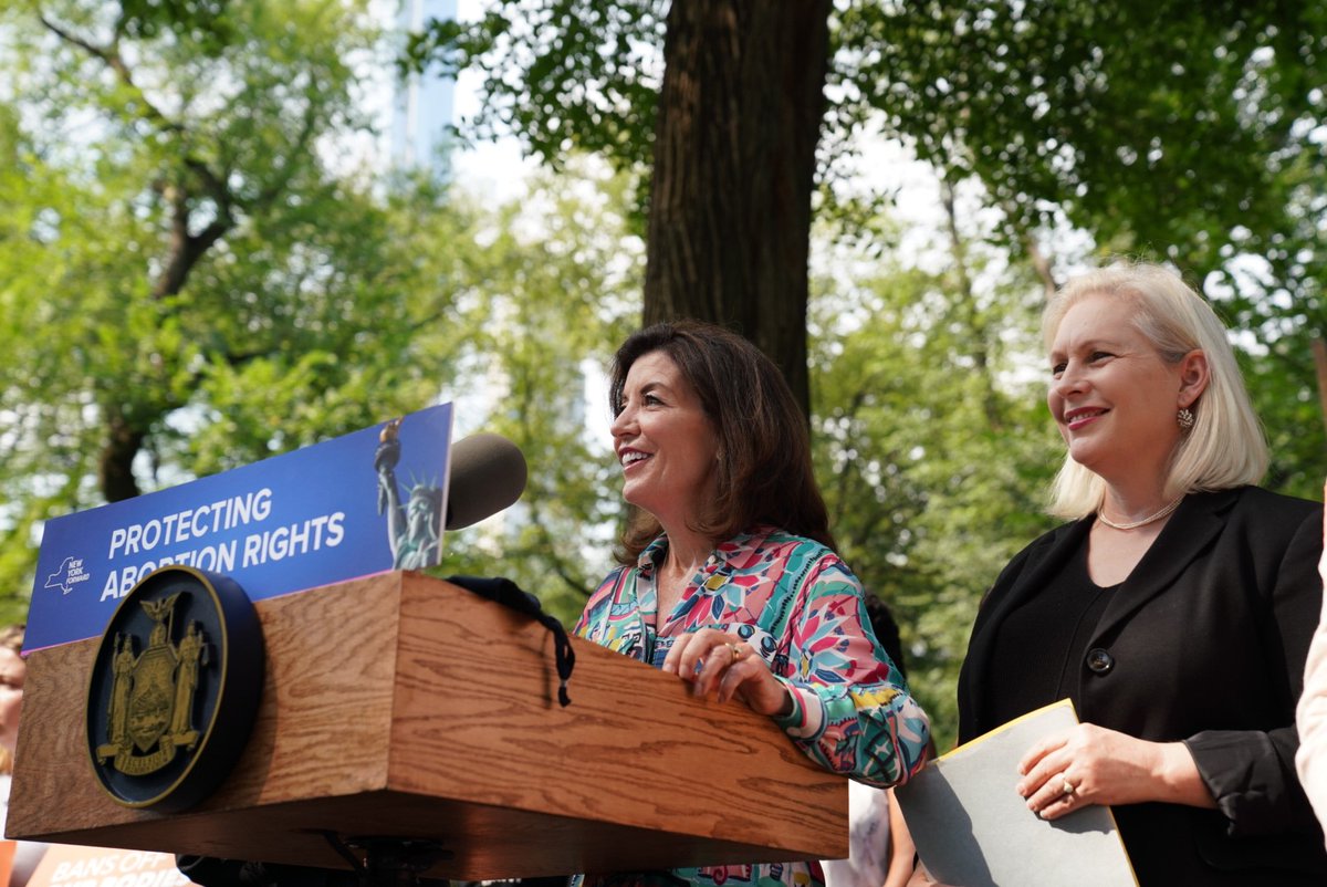Gov. Kathy Hochul speaks next to Sen. Kirsten Gillibrand.