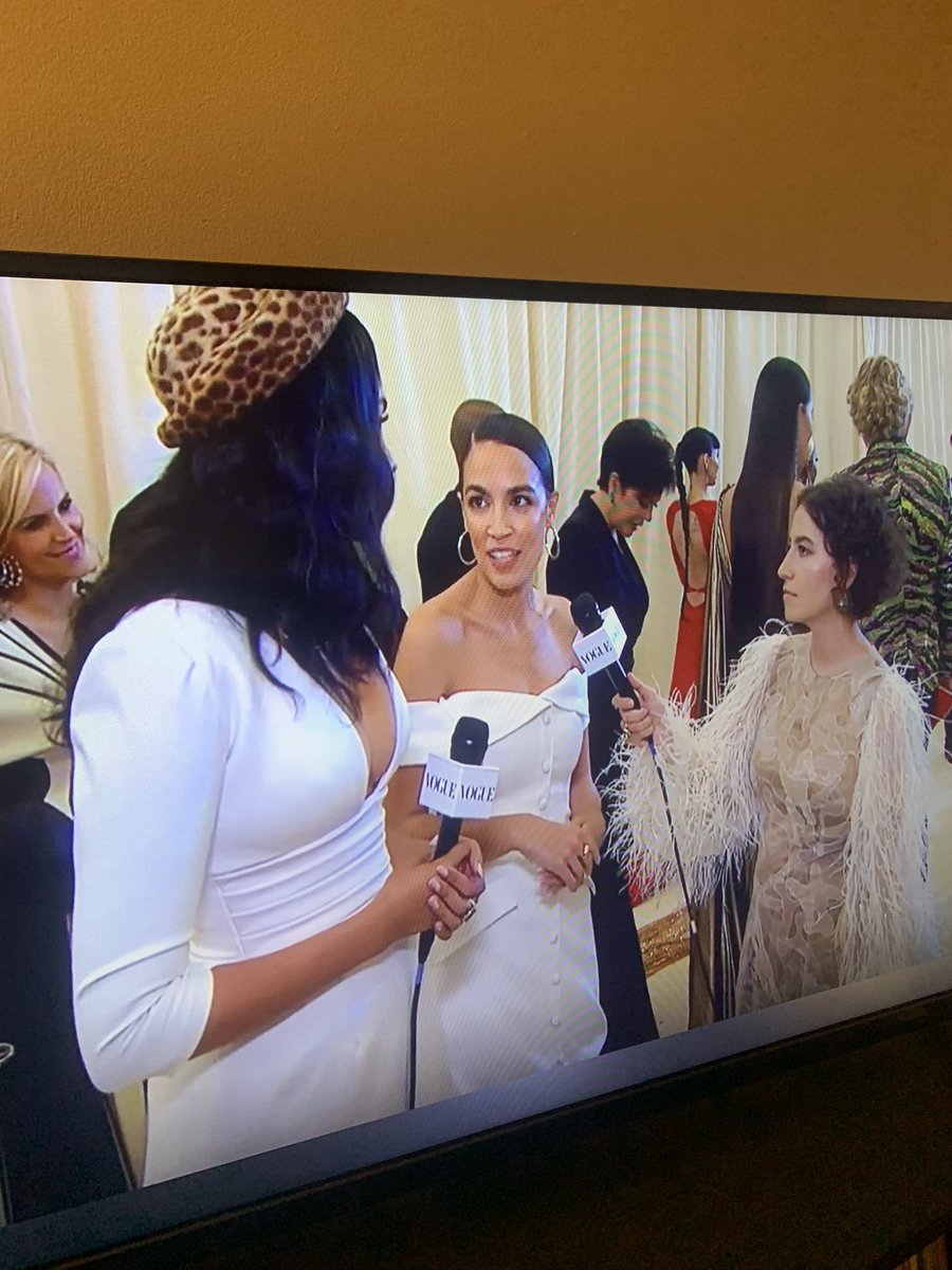 highxculture's tweet photo. AOC wearing a Tax the Rich dress at the #MetGala with Kris Jenner over her shoulder wow icon https://t.co/rY3ZMsOED3