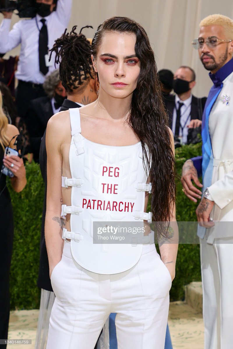 metgaIa2021's tweet image. Cara Delevigne wearing an outfit that says “Peg the Patriarchy” at the #MetGala