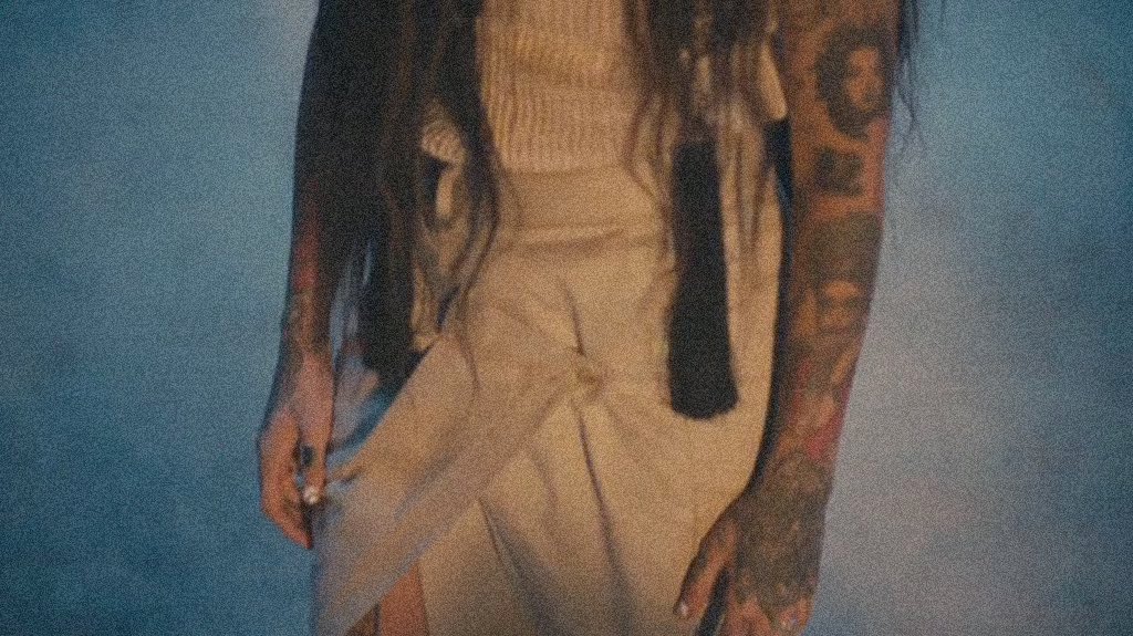 142. The teaser sees a broken and battered Kehlani emerge into a new world