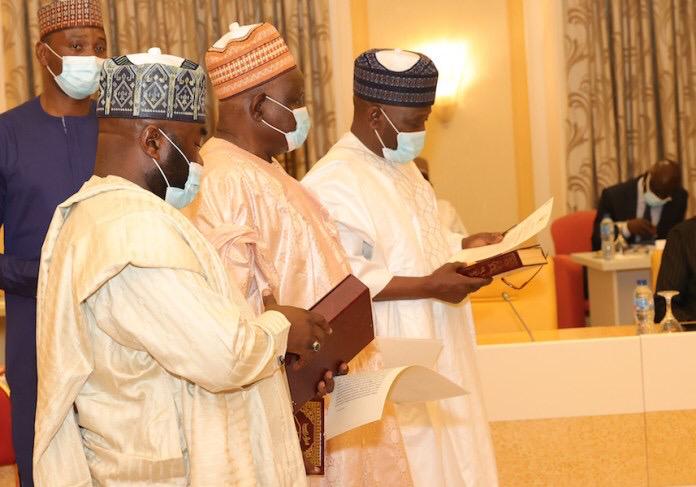 FEC: President Buhari Swears In Three INEC National Commissioners