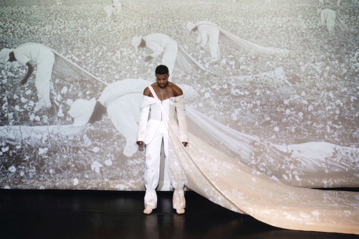 whoratiomccoy's tweet image. i find it very telling that i haven’t seen one single tweet acknowledging jeremy pope’s all cotton met outfit, which provides easily the most scathing and apt depiction of “american fashion” that was seen on the carpet.