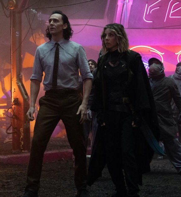 loki and sylvie walking around as close as possible after knowing each other for a day