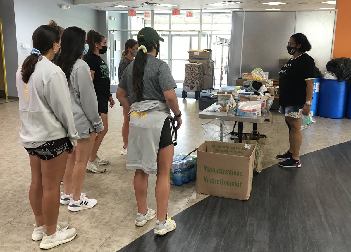 MNTNMVR_777's tweet photo. @GoMasonLax receiving instructions from @gracecov #GraceLoves outreach team on preparing care packages and items for distribution to local families in need. https://t.co/hpzoAIW6VU
