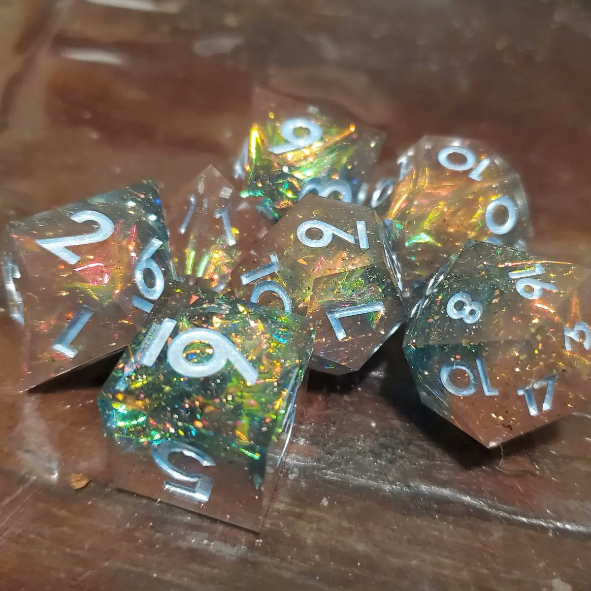 czmAvery's tweet photo. Finally finished my set of uninked Pastel Galaxy from @dispeldice ! Paints are 2 coats of Folk Art Metallic Ice Blue + 1 (generous) coat of DecoArt Enchanted Shimmer Gold. It's hard to see the glitter in still pics, but I'm so happy happy the results! https://t.co/tTOPk91N0V