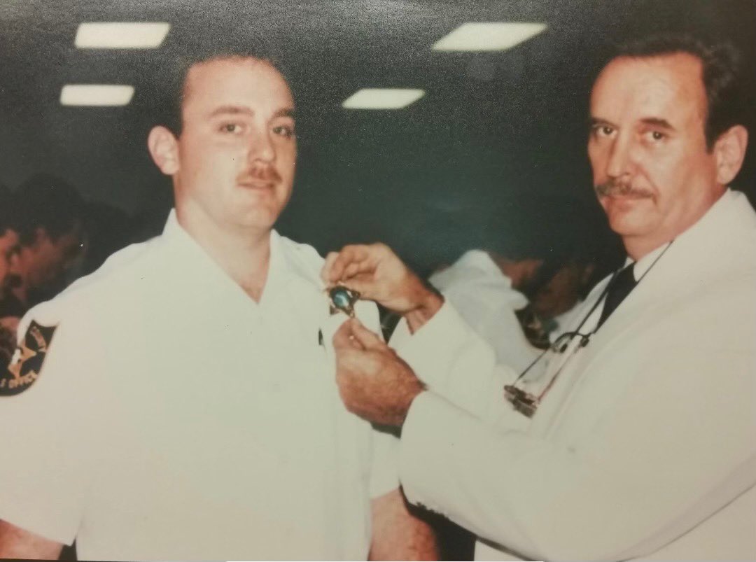 browardsheriff's tweet photo. When Deputy Kurt Bukata graduated from the police academy in 1990 at Broward College, his father had the honor to present his badge. Thirty-one years later, at Deputy Bukata's retirement, the pair had the opportunity to recreate the moment. https://t.co/Z1AAnmqHgO