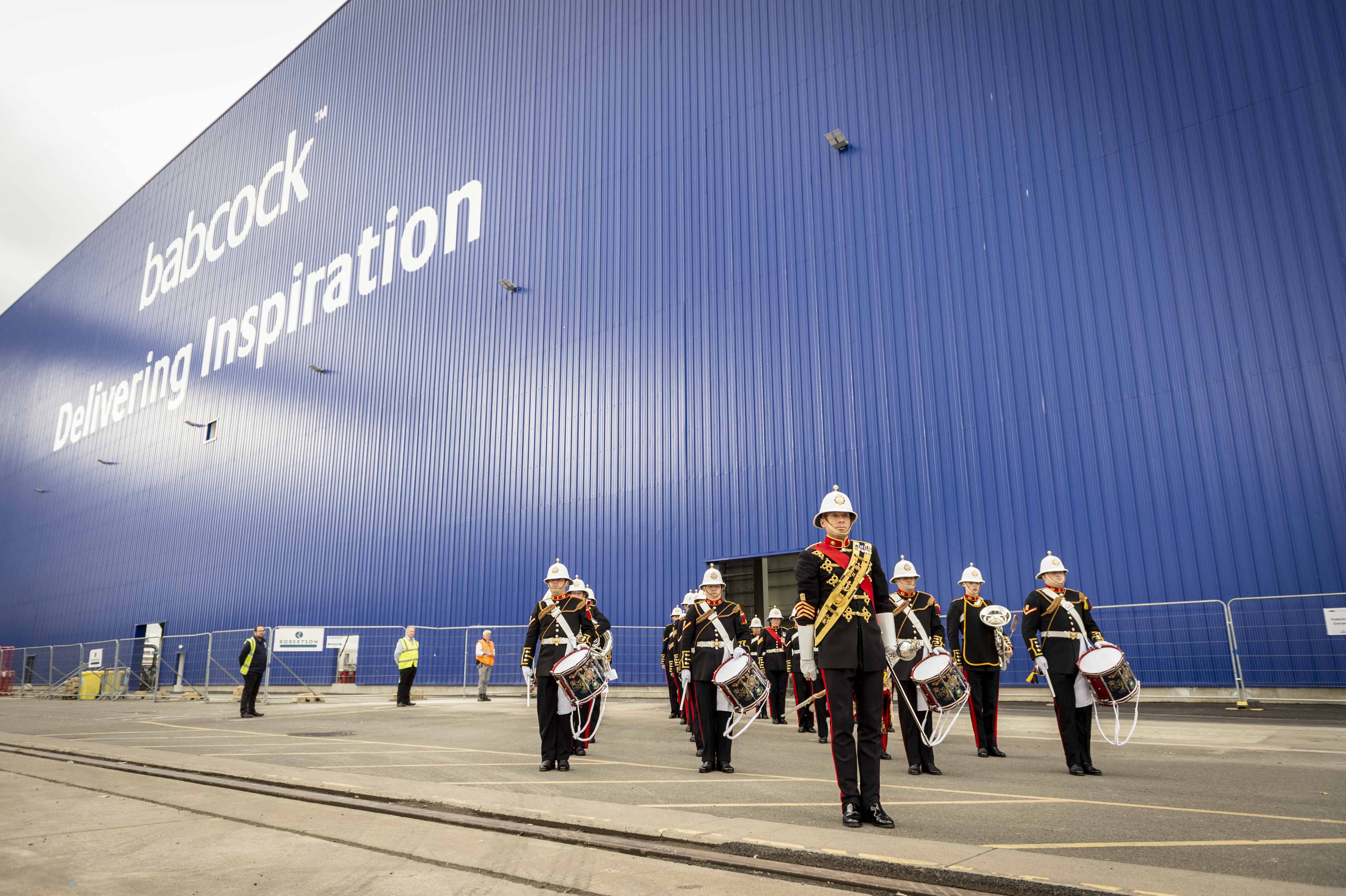 The Royal Marines Band performs outside the new assembly hall