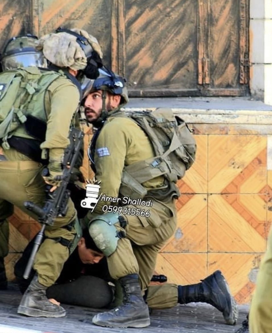 Barahmeh's tweet image. Israeli soldiers brutally arresting a child today in Hebron. The US gives Israel $3.8 billion in military funding a year.