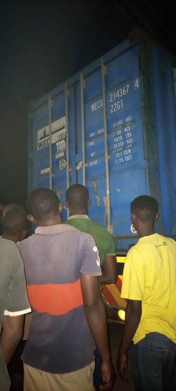 BookAidTrust's tweet photo. More than a month later than expected and the container has arrived! Our partner writes that it was delivered at 8pm and the COVID curfew starts at 10pm. Thankfully the team unloaded it box by box in one hour. #bookaidtrust #Kenya https://t.co/tnsIa7qRtD