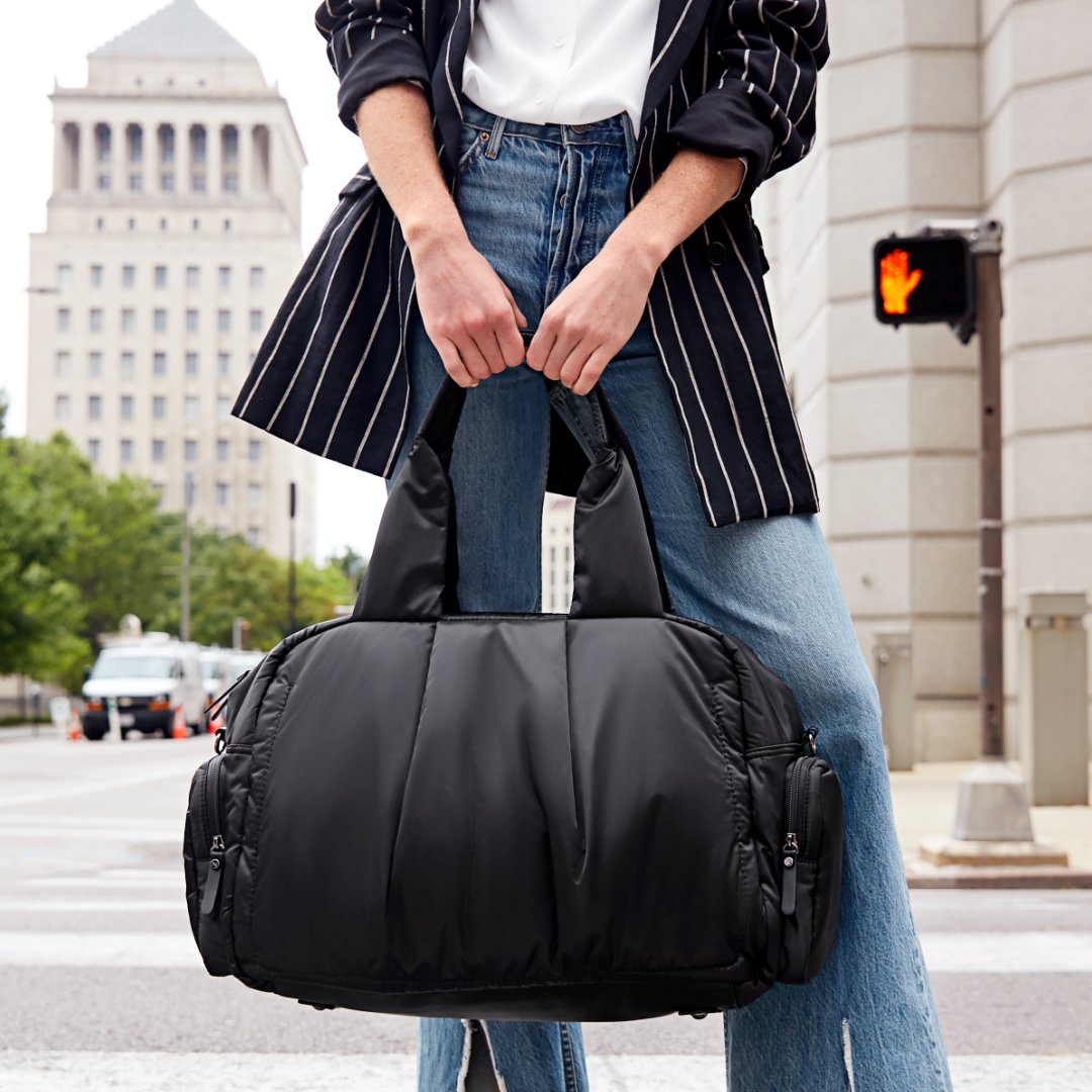 Girl on the go // Our unbelievably soft PILLOW duffel bag is perfect no matter where you're headed.