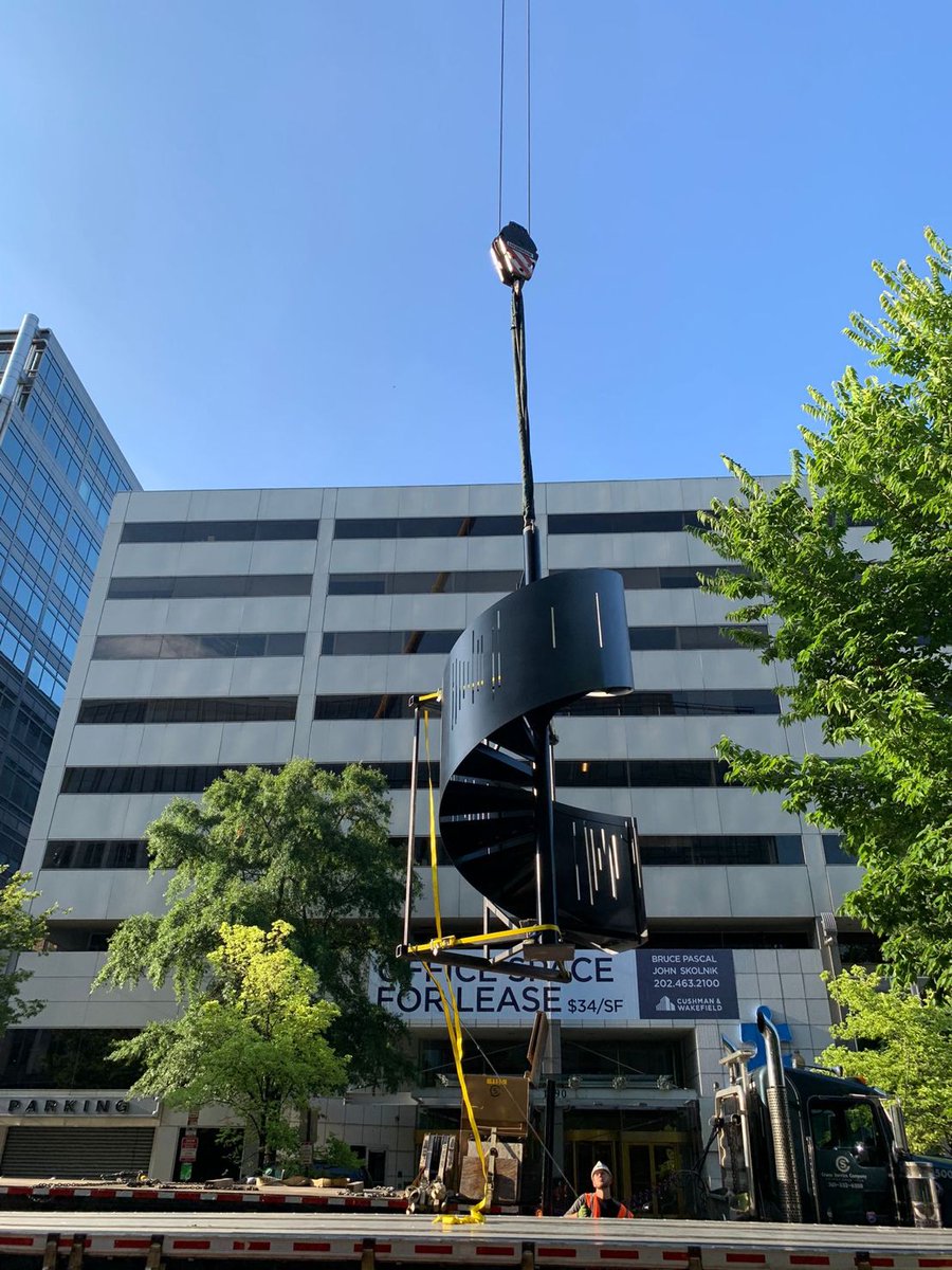 HITTContracting's tweet photo. Going up? Check out what it takes for our #HITTBaseBuilding team to install a new monumental stair on their latest jobsite at 1999 K Street in #DC for @cushwake. Designed by @HickokCole, this winding metal stair will connect the 12th floor to the building’s penthouse space. https://t.co/hHflGmhIdg