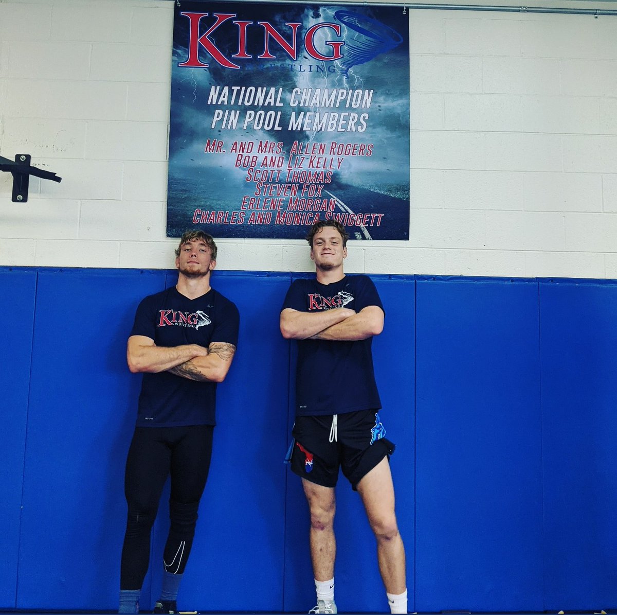 KING_mwrestling's tweet photo. The first ever National Champion Level Pin Pool members are finally up on display in our room to commemorate their substantial contribution to the program! Thank you to all of our Pin Pool members for your support! We are excited to run it back again this season! #SOUNDTHESIREN https://t.co/HzImT3VcqT