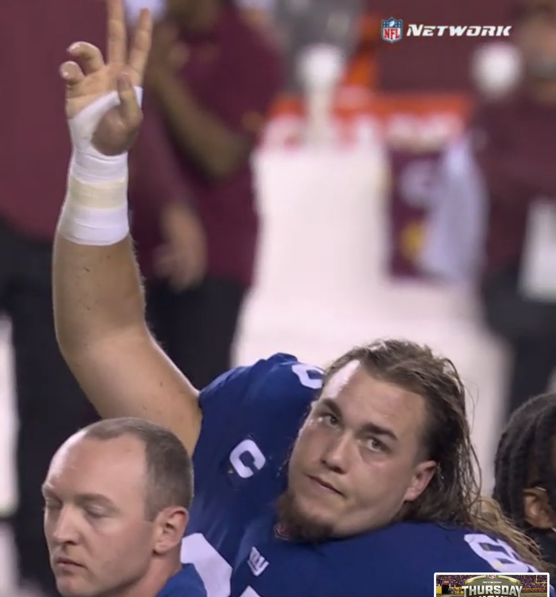 NFLonFOX's tweet photo. Teammates gather around as Giants C Nick Gates was carted off the field. 🙏 https://t.co/14lBjADsRF