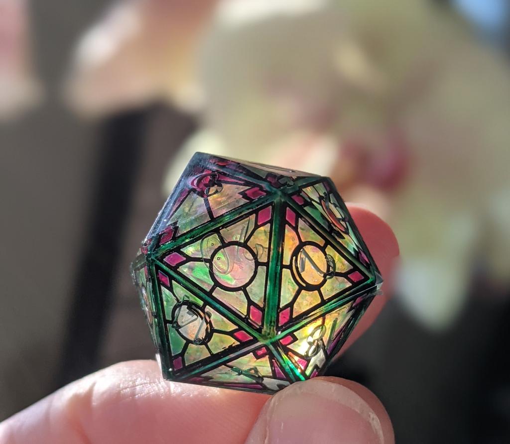 rg_diceboutique's tweet photo. This is a color test inspired by Luna Moths.  The numbers haven't been painted yet, but, it's a fun glimpse into the future while I toil away. #dungeonsanddragons #dnd #dice #handmadedice #rpg #Pathfinder #d20 #polyhedraldice #stainedglass #moon #lunar https://t.co/l4YRnGt8xO