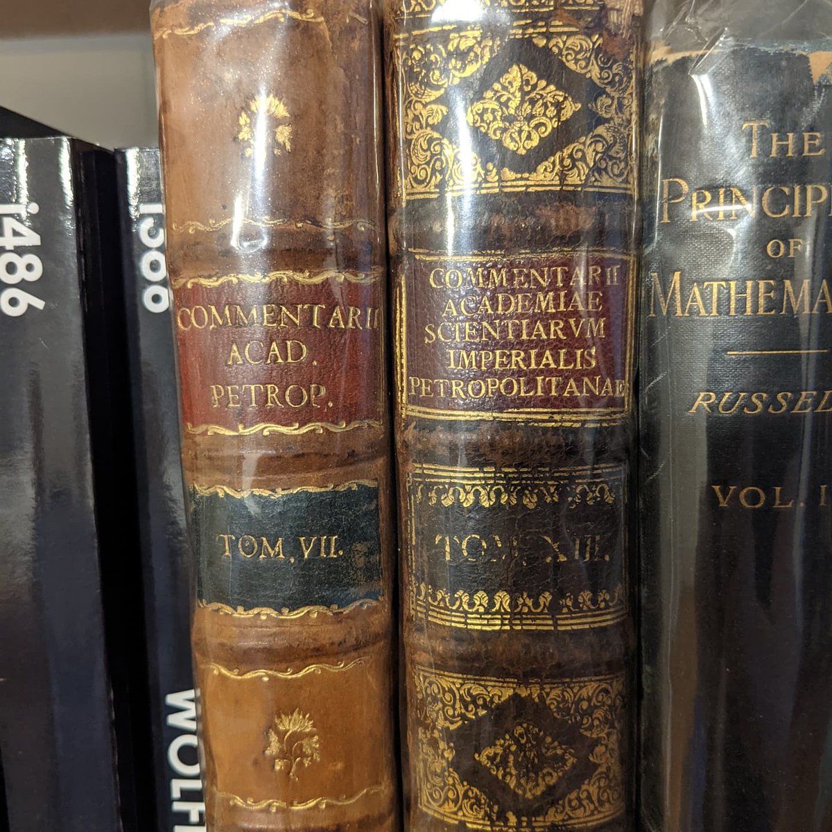 _chenson__'s tweet image. I figured my math followers would especially appreciate this! Just got these, they are originals from 1740 and 1751. Include the original publication of Euler's solution to the Basel problem, among other very cool things. So crazy to have these pieces of history on my bookshelf.