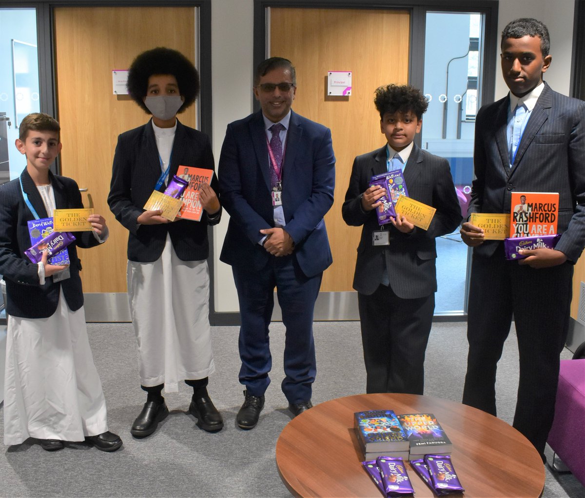 EBLAeast's tweet photo. During STAR Readers today, 'Golden Tickets' were hidden in books and classrooms around the Academy for students to find. Our 'Golden Ticket' holders were then presented with a prize of books by Mr Hussain. #reading #aloveforreading #starreaders @StarAcademies #roalddahlday https://t.co/rpJqne6guN