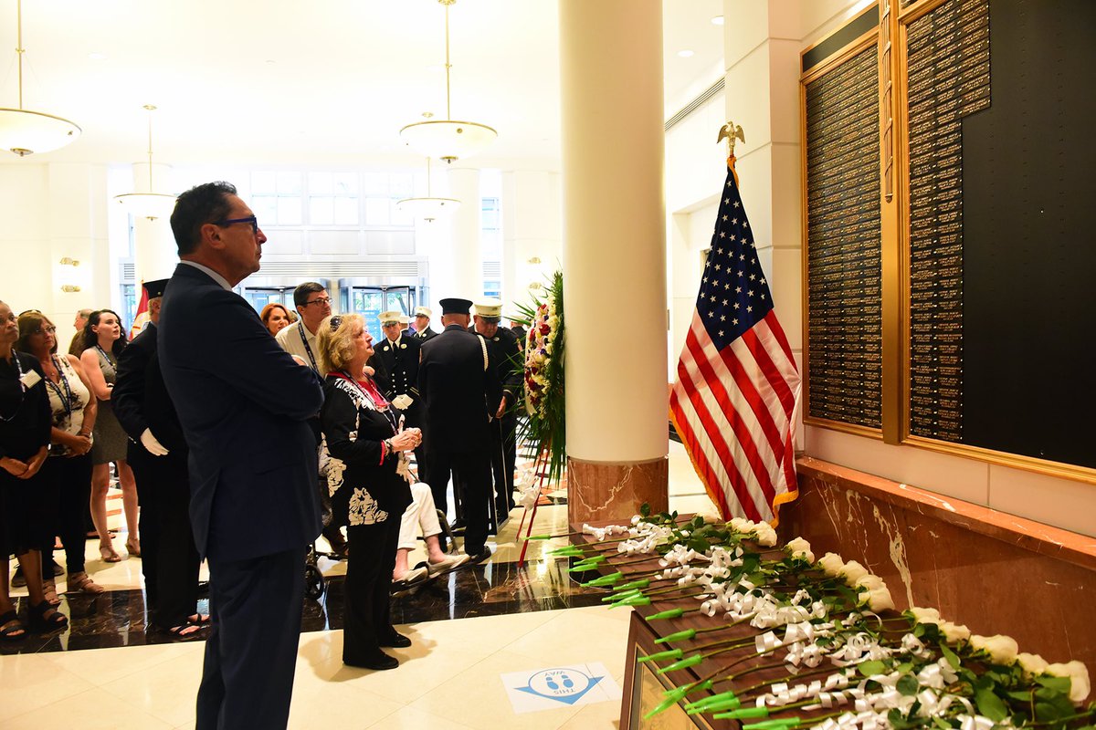 FDNY's tweet photo. Earlier this week, FDNY Commissioner Nigro added the names of 25 FDNY members who have died of illnesses related to their work in the World Trade Center rescue and recovery efforts to the World Trade Center Memorial Wall. View the ceremony at https://t.co/EBBejfs0cm #NeverForget https://t.co/29RhYxMeeC
