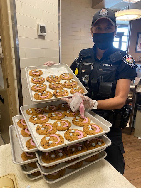 OttawaPolice's tweet photo. @ottawapolice officers have had the privilege of handing out #SmileCookies across #Ottawa this week. The @snowsuitfund is near and dear to our hearts and this is a great opportunity to raise much-needed funds for our community. Get your Smile Cookies @TimHortons until Sept. 19th! https://t.co/QvTVB0dXuu