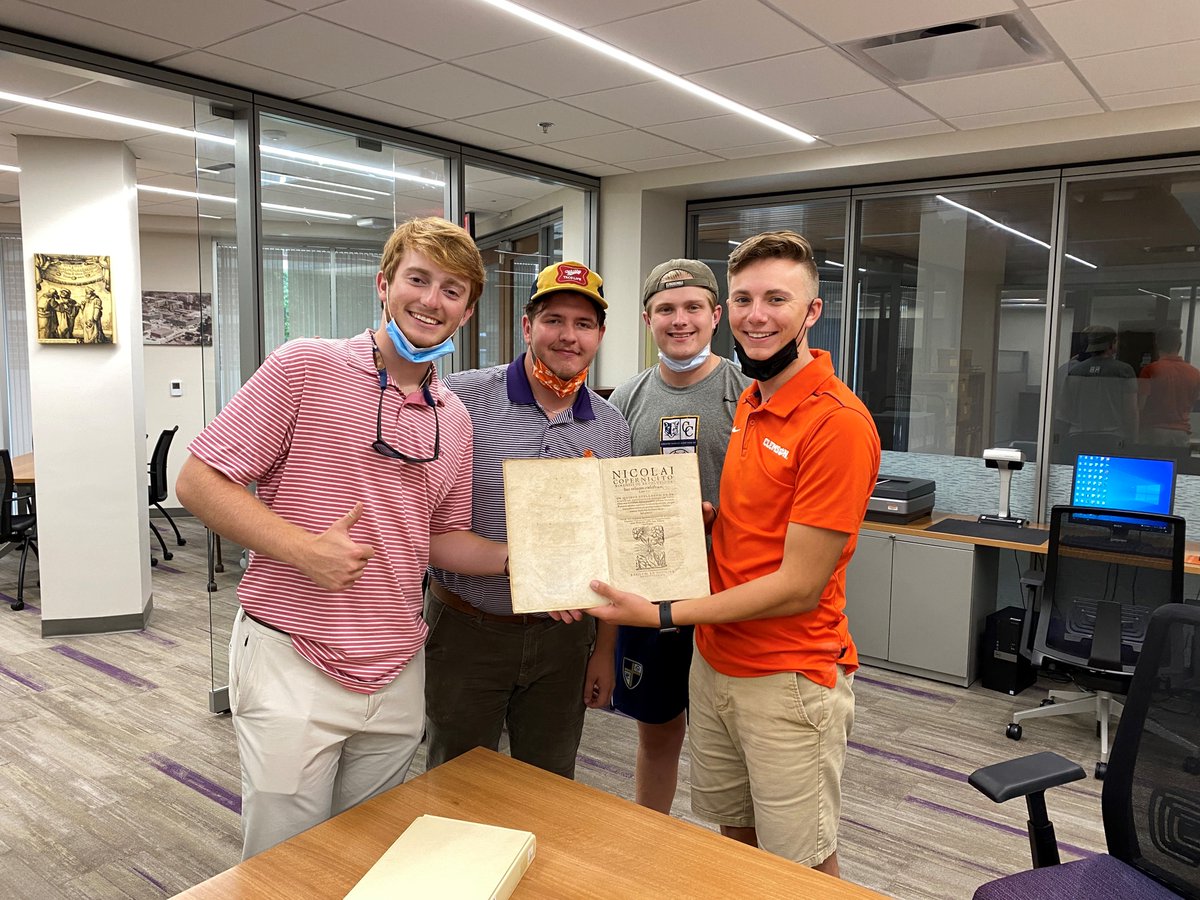 A love my job day!  A great way to end the day and week.  Clemson students visiting the Archives to see one of our oldest books and discovering so much more in the Archives.  Their masks were only off very briefly for the photo.