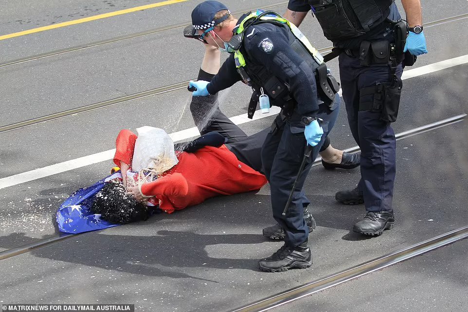 JP__75's tweet photo. Elderly lady smashes her head on the ground after being violently pushed to the ground by a @VictoriaPolice member and then pepper sprayed while lying on the ground, defenseless. 

When she comes to her senses, you can explain to her that it was just to keep her safe.

#vicpolice https://t.co/8bthqZcvJ2
